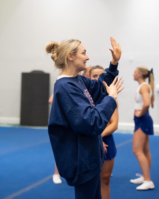 Mel Bull coaching on the mat